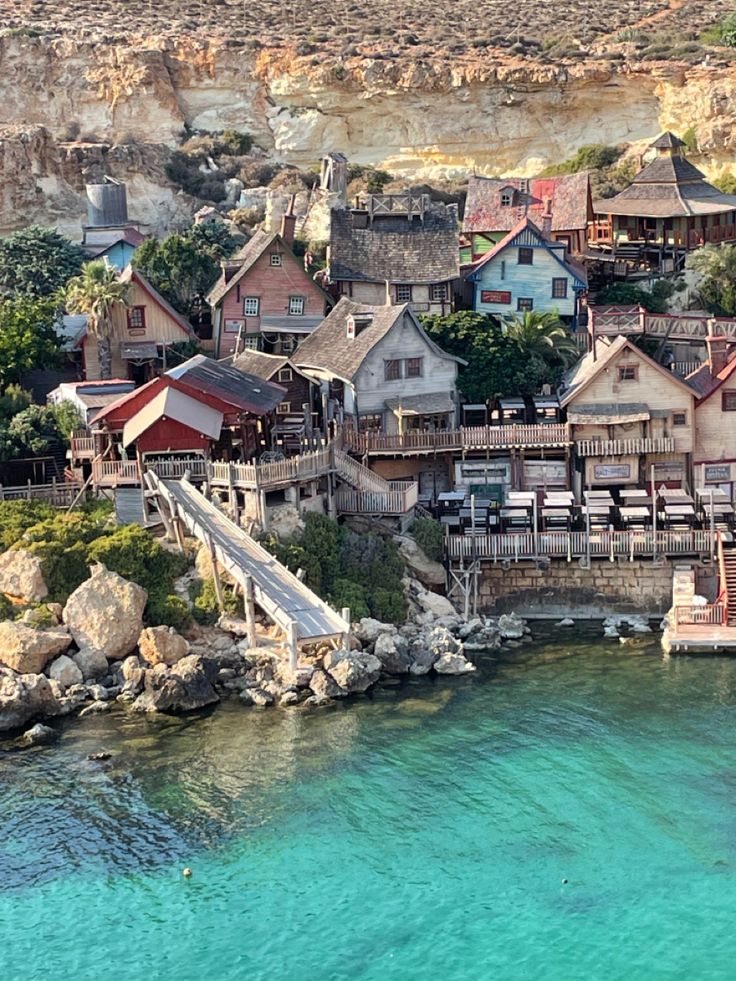 an aerial view of houses on the water