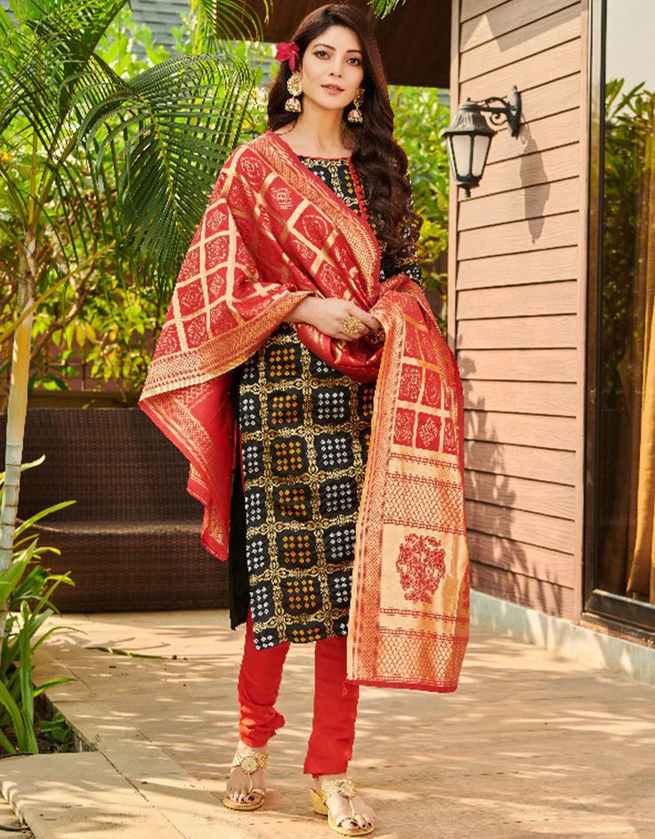 Black Bandhani Silk Blend Chudidar Salwar Suit Semi-stitched Jamawar Sets With Motifs, Multicolor Transitional Salwar Kameez With Traditional Drape, Traditional Semi-stitched Salwar Kameez With Zari Weaving, Multicolor Anarkali Churidar With Pallu, Fitted Anarkali Banarasi Silk Churidar, Fitted Festive Traditional Wear With Motifs, Festive Bandhani Print Churidar For Transitional Season, Festive Semi-stitched Salwar Kameez For Puja, Fitted Art Silk Sets With Motifs