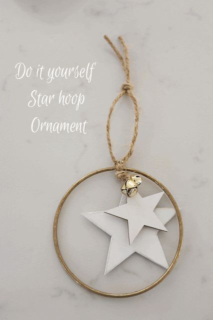 an ornament with a star hanging from it's side on a table