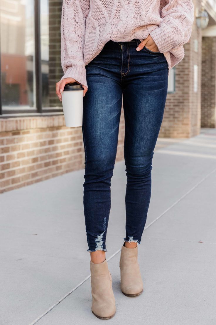 These trendy distressed hem jeans are such a must-have style for any season! We love the timeless dark wash color paired with distressed details at the hems! It's so easy to wear this style with a variety of vibrant blouses, layering tanks, and classic neutral cardigans! 71.9% Cotton, 23.8% Polyester, 2.8% Rayon, 1.5% Spandex Machine wash cold inside out / Tumble dry low Materials may have natural variations Colors may vary from different viewing devices. Everyday Jeans Outfit Casual, Autumn Jeans Outfits, Pink Sweater Outfit Fall, Distressed Jeans Outfit Fall, High Waisted Dark Jeans, Amazon Must Haves Clothes, Getaway Outfit, Outfits Jeans, Boutique Pants