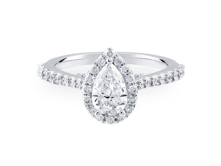 a pear shaped diamond engagement ring on a white background