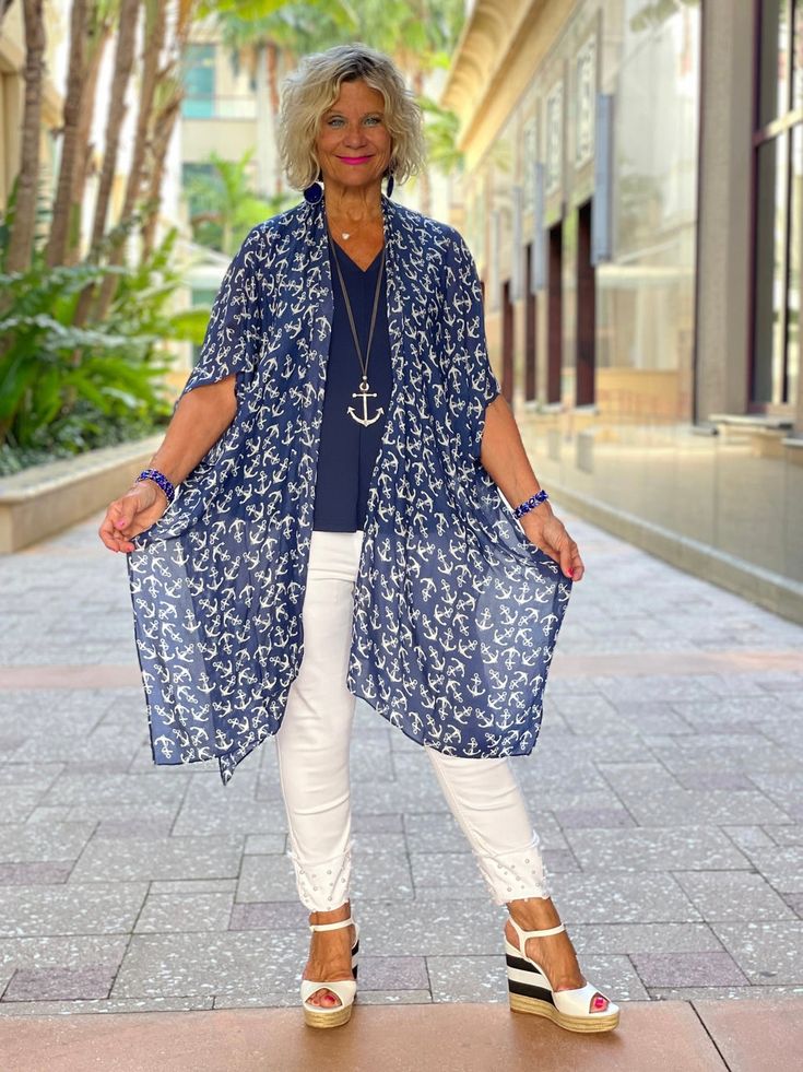 Printed Kari Kimono: Navy with White Anchors The one size Kari printed kimono completes any outfit or pairs beautifully with your favorite swimsuit! Details & Care: Cathy is 5'6 size small top and 8 jean One Size 100% viscose 37" L x 37" W Casual V-neck Rayon Kimono, Casual Flowy Cover-up With Kimono Sleeves, Casual Short Sleeve Summer Kimono, Spring Short Sleeve Free Size Cover-up, Casual Rayon Kimono With V-neck, Casual One Size Kimono For Beach Cover-up, V-neck Kimono For Beach, Flowy Casual Kimono For Day Out, Printed Open Front Cover-up For Day Out