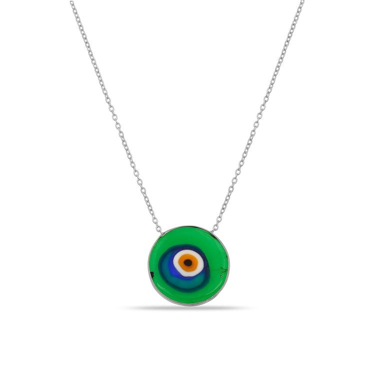 Artful and timeless, the Antique Evil Eye Necklace is imbued with uncommon character. Spend a moment gazing into this glass pendant's swirls of emerald green, indigo, and amber and you're sure to be entranced. Layer with other colorful evil eyes and bold metallics to let the good vibes roll. Or pair with our Antique Evil Eye Earrings for the most original RAGEN combo. 14k gold plated sterling silver 16-18" Adjustable in length Translucent green evil eye charm: .5" in width Handmade and painted i Green Nickel-free Pendant Charm Necklace, Multicolor Circle Necklace For Gift, Green Spiritual Necklace With Birthstone, Multicolor Circle Necklace Gift, Green Spiritual Jewelry With Evil Eye, Spiritual Green Jewelry With Evil Eye, Nickel Free Circular Spiritual Necklace, Necklace With Large Glass Pendant As Gift, Glass Necklace With Large Pendant As Gift