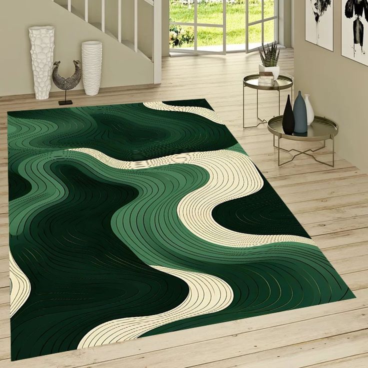 a living room area rug with green and white swirls on the floor in front of stairs