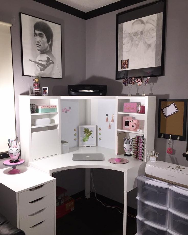 a white corner desk with lots of drawers