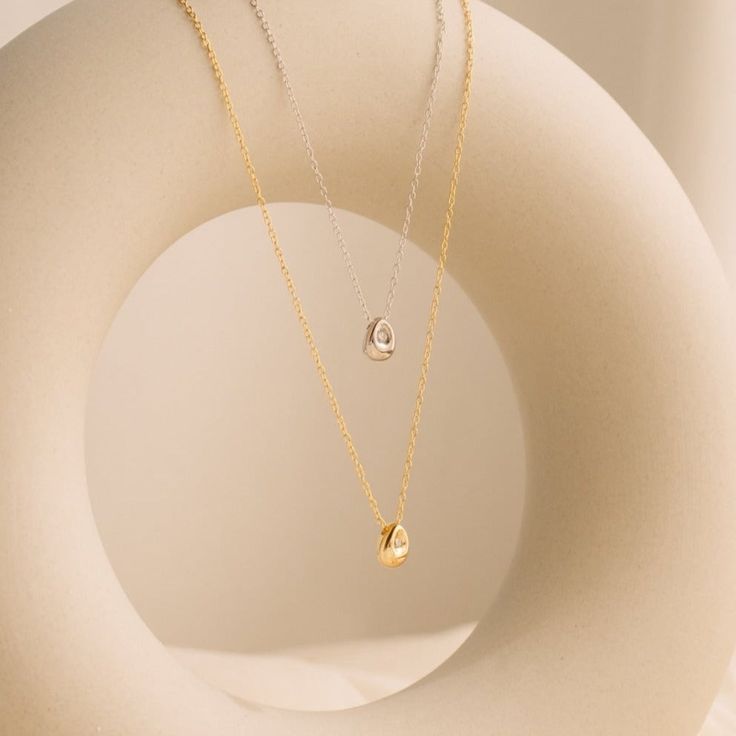 • Material: High Quality Solid 925 Sterling Silver• Finish: Sterling Silver ∙ 18K Gold• Featuring Dainty 7mm Teardrop Charm, in case 1mm diamond. Adjustable length 16 inches to 18 inches SKU: RR-NR060 The Nugget, Nugget Necklace, Almond Shaped, Bezel Set Diamond, Drop Pendant, Staple Pieces, Diamond Stone, Solid 925 Sterling Silver, Ring Necklace