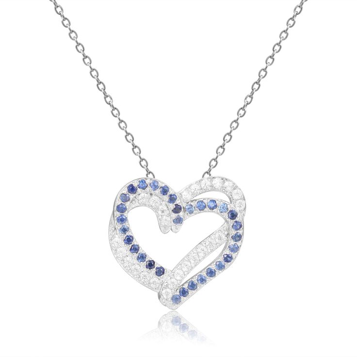 This lovely heart shaped pendant necklace feature two sterling silver hearts, as the gorgeously designed pendant. One heart is encrusted with shining White Sapphire and the other is a beautifully colored Blue Sapphire. Metal - Sterling Silver Metal Weight - 2.70gms. Main Stone - Sapphire Main Stone Shape - Round Main Stone Color - Blue Main Stone Weight - 0.32ct. Accent Stone - White Sapphire Accent Stone Weight - 0.32ct. Fine Color Jewels Dean Collection | Round cut Natural Blue Sapphire Pendan Sapphire Heart Necklace, September Birthstone Necklace, Blue Topaz Pendant Necklace, Pink Sapphire Pendant, Pear Shaped Pendant, Ruby Necklace Pendant, Blue Sapphire Pendant, Sapphire Necklace Pendants, Open Heart Necklace