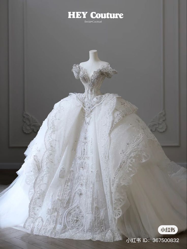 a white wedding dress on display with the words hey couture written above it