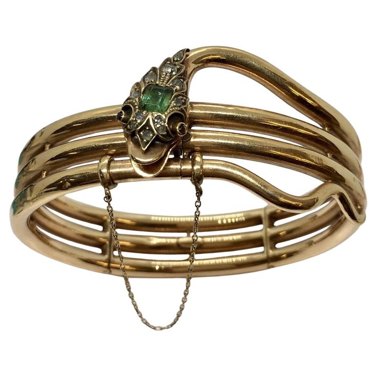 Edwardian Diamond Emerald Bangle Snake Bracelet Silver Top 14K American Gold 1900s 27.1 gram Acid tested 14K Gold, Silver top Outer diameter; 2.5 inch by 2.25 inch, with 1/4 inch Thickness Spring is loaded and in perfect condition folding in three sections, Three Part Loaded Hinged 4 mm by 5 mm Square Emerald & 11 Rose Cut Diamonds plus Garnet or Ruby eyes all set on Silver, Silver Top Well cared for, few dents, minimal abrasion consistent with 130 Yrs of age, perfectly functional, see pictures Antique Yellow Gold Hallmarked Bangle, Vintage 14k Gold Hallmarked Bangle, Antique Hallmarked Yellow Gold Bangle, Antique Stamped 14k Bangle Bracelet, Antique 14k Gold Bangle Bracelet, Vintage 14k Stamped Bangle Bracelet, Vintage 14k Gold Bangle, Antique 14k Gold Bangle, Victorian 14k Gold Bangle Bracelet