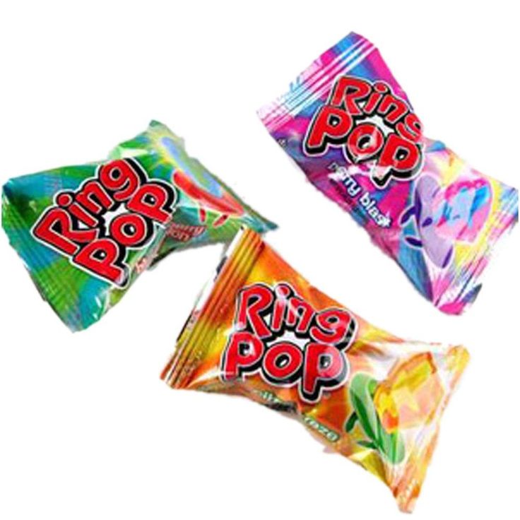 three colorful candy bars sitting next to each other on a white surface with the word ring pop printed on them