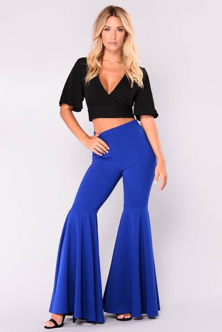 These high waist, high ruffled pants are uniquely sexy. Featuring an elastic waist with a fitted form to flared ruffled legs that pair perfectly with wedges, heels or booties. These pants pair perfectly with bodysuits or cropped tops so be sure to visit our Bodysuits and Tops Collections to complete your look. Made with a cotton and polyester blend to hug your every curve. Comes in seven fabulous colors from which to choose. Fitted Flare Pants, Flare Outfit, Ruffled Pants, Bell Bottom Trousers, Wedges Heels, High Waist Wide Leg Pants, Ruffle Pants, Cropped Tops, Bell Bottom Pants