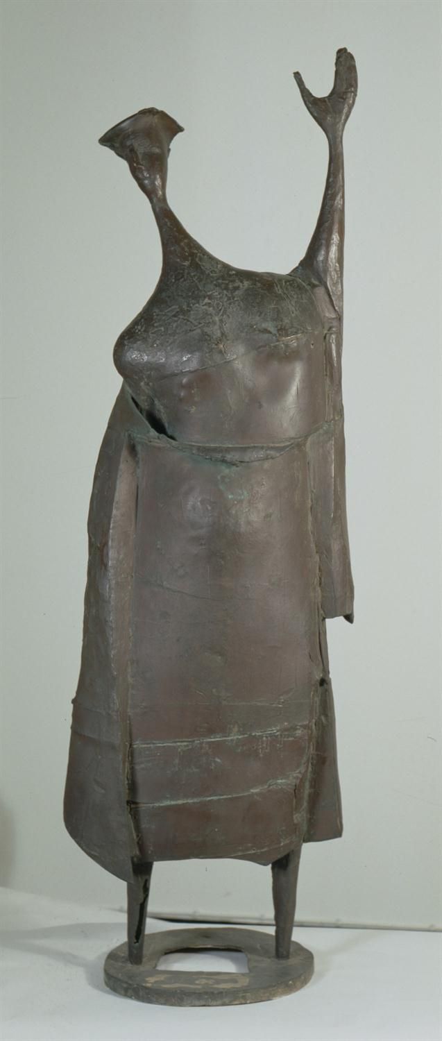 a statue is shown on a white surface