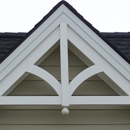 the corner of a house with a white roof