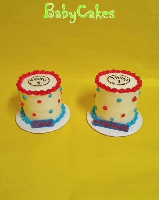 two small cakes are sitting on top of each other in front of a yellow background