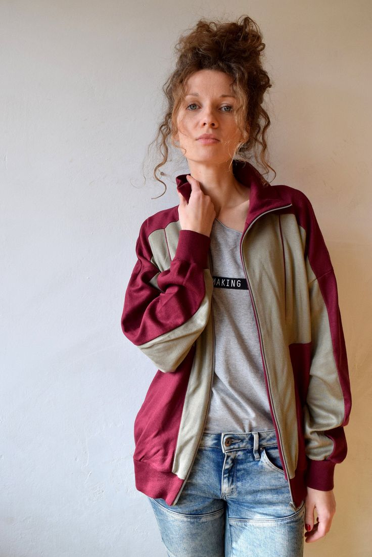 "Bordo workout jacket, vintage bomber, tracksuit, outdoor jacket, 90s activewear, men running jacket, women windbreaker, sports jacket, M/L Vintage bordo workout jacket with gray color block. Jacket has two side pockets and nice high collar to protect you from wind and make you feel cosy! Size: given GB 16, seems like women (L) and men (M) PLEASE CHECK ALL MEASUREMENTS BELLOW: Length: 63 cm/ 25\" Shoulder to shoulder: 64 cm/ 25\" Sleeves: 50 cm/ 20'' Chest: 122 cm/ 48\" Condition: excellent Fabr Cotton Athleisure Track Jacket For Streetwear, Athleisure Cotton Track Jacket With Pockets, Sporty Long Sleeve Track Jacket With Relaxed Fit, Cotton Athleisure Track Jacket With Pockets, Fall Workout Track Jacket With Pockets, Sports Cotton Long Sleeve Windbreaker, Cotton Windbreaker For Streetwear, Cotton Streetwear Athleisure Windbreaker, Cotton Athleisure Windbreaker For Streetwear