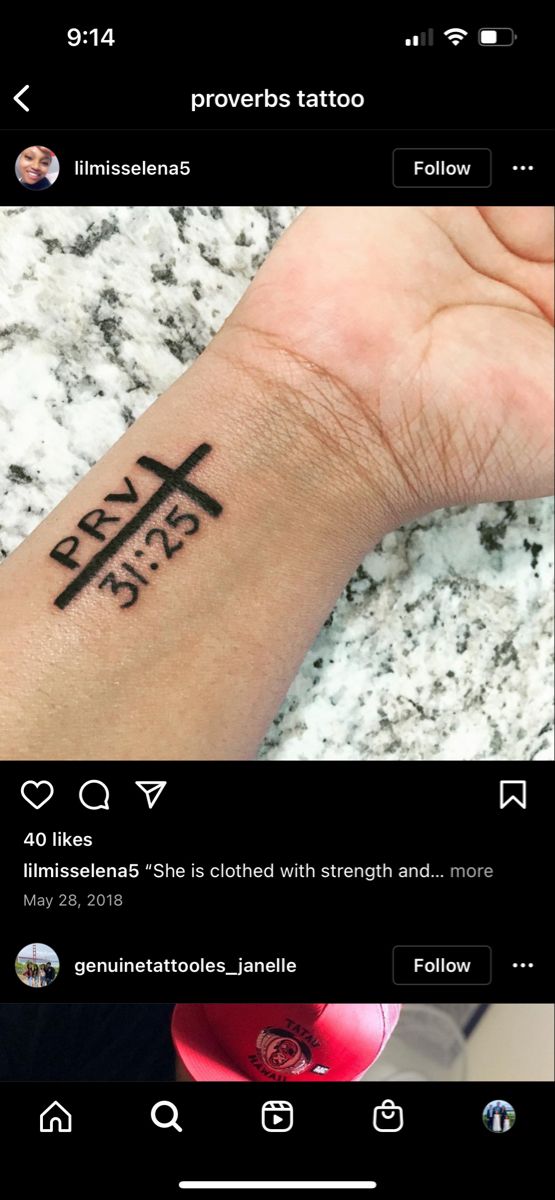 a person with a cross tattoo on their wrist