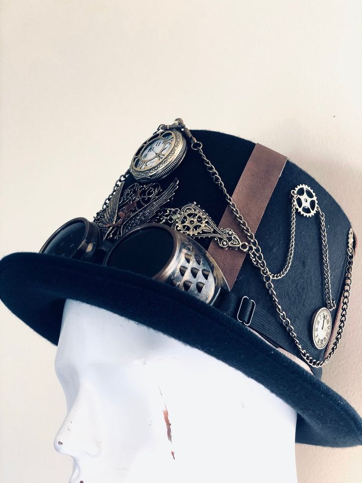 Our brown/black steampunk hat with goggles radiates sophistication, join the steampunk revolution and claim your spot among the fashion-forward. Perfect for themed events, cosplay, or adding a dash of steampunk to your everyday attire.


Age Group/Gender - Adult/Unisex

Size/Type - One size fits all adults
Color - Brown/Black Hat With Goggles, Black Goggles, Steampunk Hats, Black Steampunk, Steampunk Mask, Steampunk Hat, Time Keeper, Masks Masquerade, Themed Events