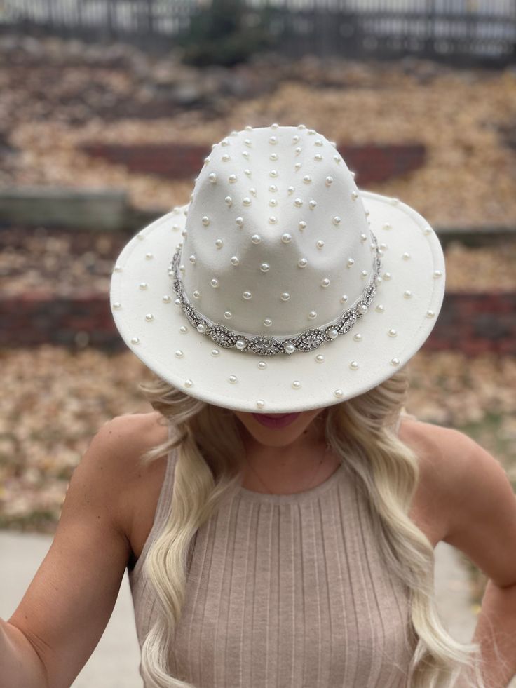 The OG pearled bridal hat with a little sparkle added! This hat is ivory with ivory pearls. Can be custom ordered in white or ivory. Cream Fedora Hat For Wedding, Adjustable White Hat For Anniversary, White Beaded Hat With Short Brim, Elegant Fitted Beaded Hat, White Beaded Short Brim Hat, Adjustable Beaded Wedding Hat, White Beaded Curved Brim Hat, Pearl Bride, Bridal Hat