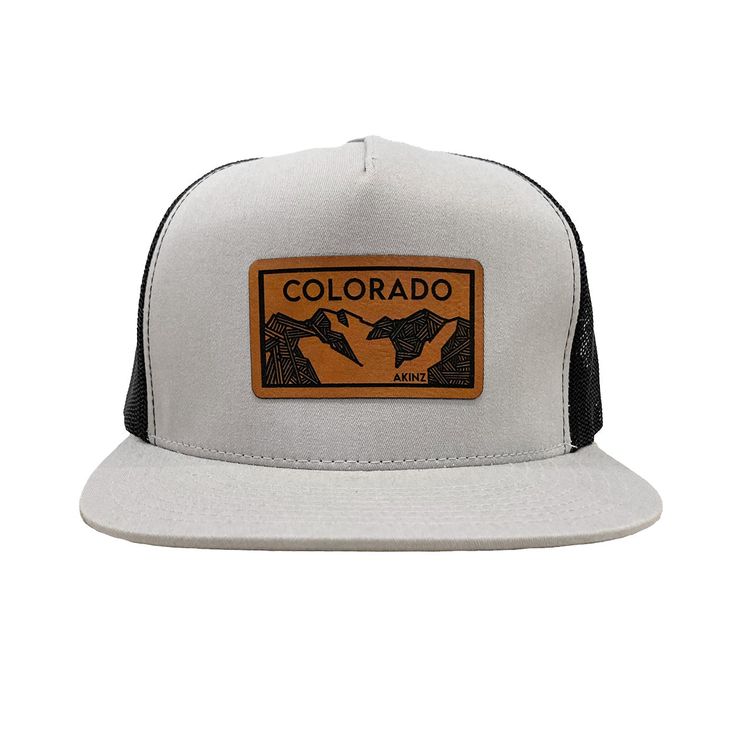 Colorado Elevation mountains faux leather patch in rawhide. Available in silver gray or black. Flat bill cotton twill front. Mesh back with adjustable snapback Urban Six-panel Trucker Hat For Outdoor, Gray Hat With Logo Patch And Curved Brim, Gray Snapback Hat With Logo Patch And Curved Brim, Urban Trucker Hat With Logo Patch For Outdoor, Gray Trucker Snapback Hat With Flat Bill, Six-panel Baseball Cap With Leather Patch For Outdoor, Outdoor Six-panel Baseball Cap With Leather Patch, Gray Snapback Hat For Outdoor, One Size Fits Most, Adjustable Baseball Cap With Leather Patch And Flat Brim