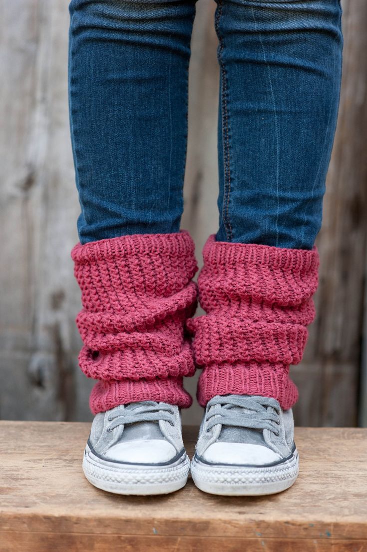 the legs and feet of a person wearing knitted shoes