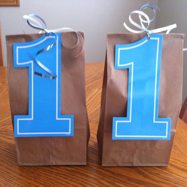 two brown paper bags with blue numbers on them