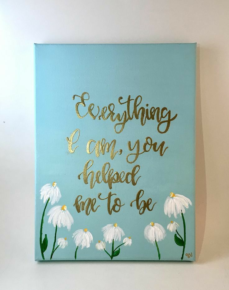 a painting with white daisies and gold lettering that says everything i am you need to be