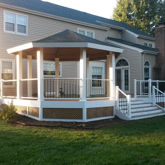 a large house with a covered porch in the front yard