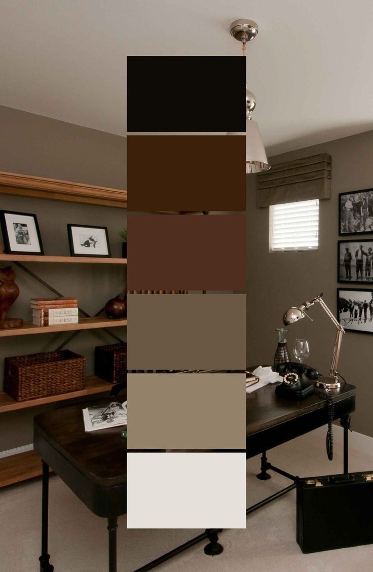 the color scheme is brown, black, and white in this home office with pictures on the wall