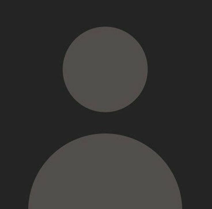 a black and white photo of two circles on a dark background, with one circle in the middle