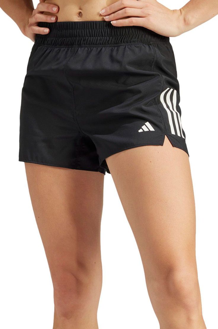 Push yourself to own the run in these lightweight adidas shorts. With moisture-absorbing AEROREADY to keep you dry mile after mile, you'll blast through speedwork and long runs with confidence. Zip pockets securely stash keys or fuel for quick access on the go. Made partly from recycled materials, you can feel good about going the extra mile. Reflective details help ensure you're seen and safe even after dark. Slip into these shorts and unleash your inner champion. Fit & Design: Regular fit Drawcord on elastic waist High rise Moisture-wicking AEROREADY Side zip pockets Zip mobile phone pocket at back waist Reflective details Sporty Running Shorts With Three Stripes, Adidas Nylon Activewear For Sports, Sporty Moisture-wicking Athletic Shorts For Marathon, Sportswear Running Shorts With Three Stripes, Adidas Moisture-wicking Running Activewear, Adidas Go-dry Activewear For Running, Adidas Activewear For Running With Go-dry, Adidas Nylon Sports Shorts, Adidas Sports Nylon Shorts