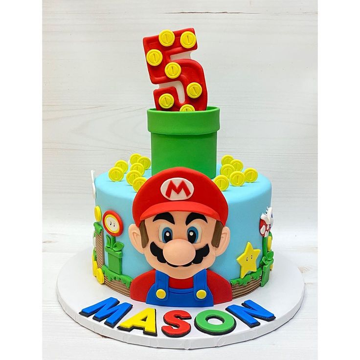 a mario birthday cake with the number five on top