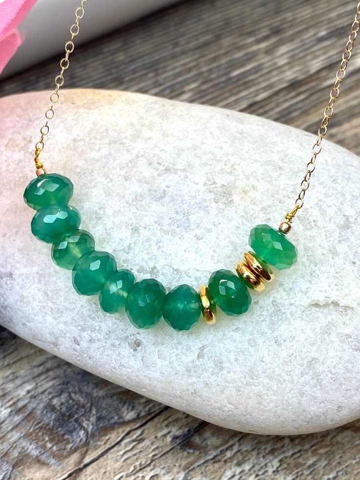 Gold filled Necklace with Emerald green onyx gemstones beads, love gift, Valentine's Day gift, mom gift, birthday gift * Gold filled chain: small oval links made from flattened wire shine as they catch the light. * 8mm Natural Emerald green onyx ( light- medium color ) Emerald green onyx is the birthstone of May. the symbol of love, hope and harmony Beautiful rich color. Great price!! Beautiful quality My jewelry will be wrapped in a beautiful gift box ready to gift. Please visitor my entire sto Everyday Emerald Necklace For May Birthstone, Everyday Green Emerald Gemstone Necklace, Green Spiritual Necklace With Birthstone, Everyday Green Emerald Necklace, Emerald Necklaces For Everyday Wear, May Birthstone, Green Jade Necklaces For May Birthstone, Emerald Necklace For Everyday Wear - May Birthstone, Emerald Necklace For Everyday Wear, Dainty Green Necklace For May Birthstone