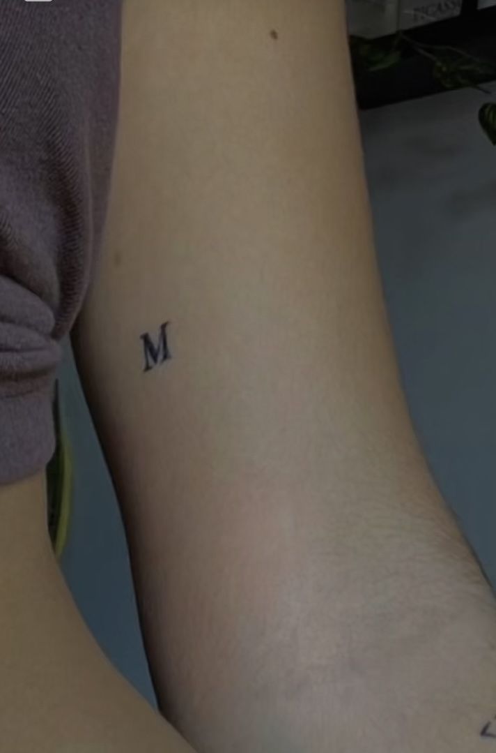 tattoo tattooideas minimalistic tattooart minimal m letter skin inspo inspiration tattoos Initials Tattoo Placement Ideas, Tattoos With Letter J Design, H And M Tattoo, 1 Letter Tattoo, Letter Minimalist Tattoo, M Squared Tattoo, Mini M Tattoo, Letter Tatooes, Tiny M Tattoo