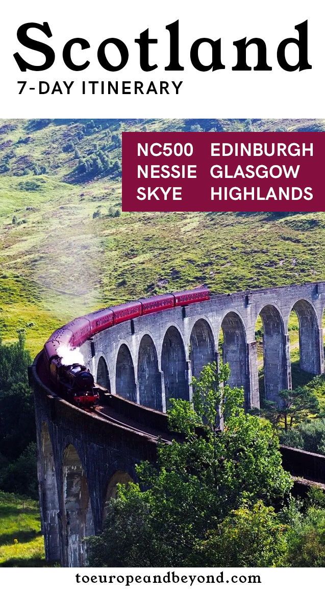 a train traveling over a bridge in scotland