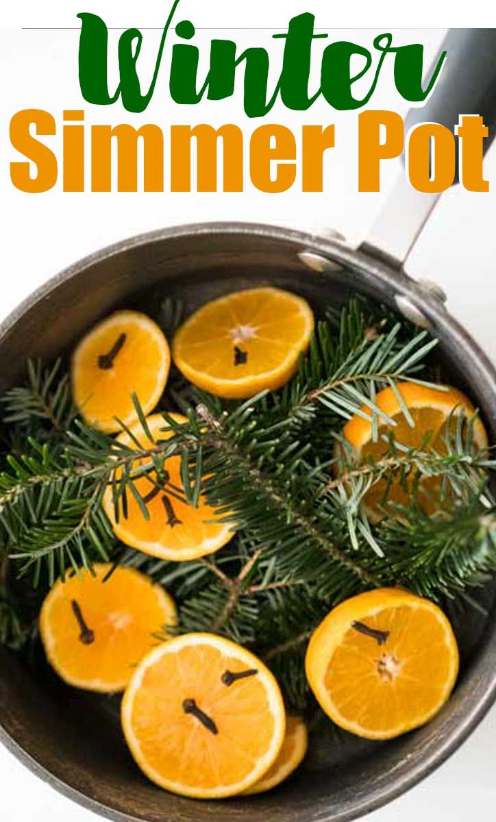 oranges and rosemary in a pot with text overlay that reads stovetop potpour