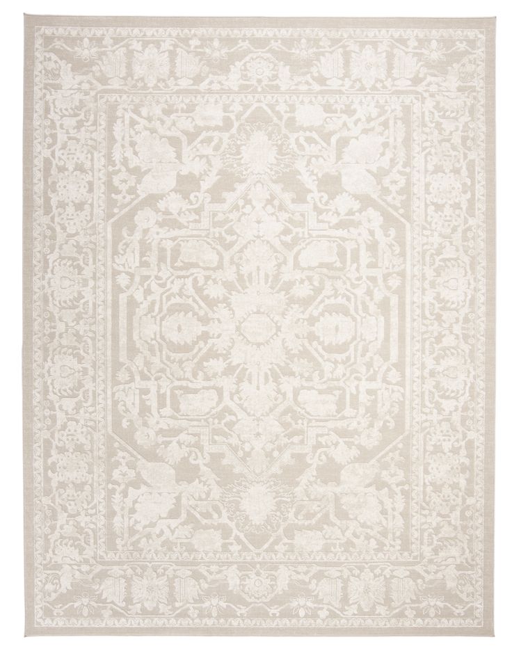 a white rug with an intricate design on the front and back side, in shades of beige