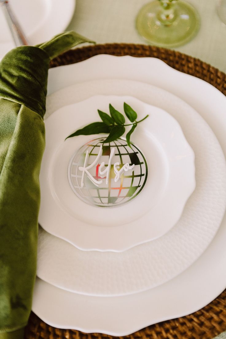 there is a plate with a plant in it on top of the placemats