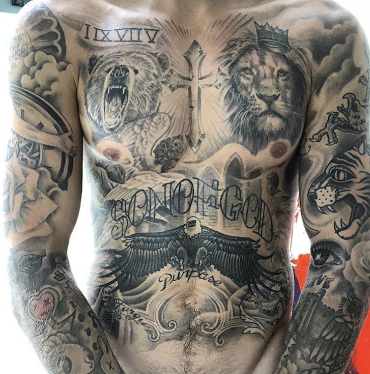 a man with many tattoos on his chest