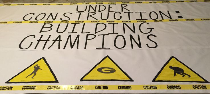 a construction sign with caution tape around it that says under construction, building champions