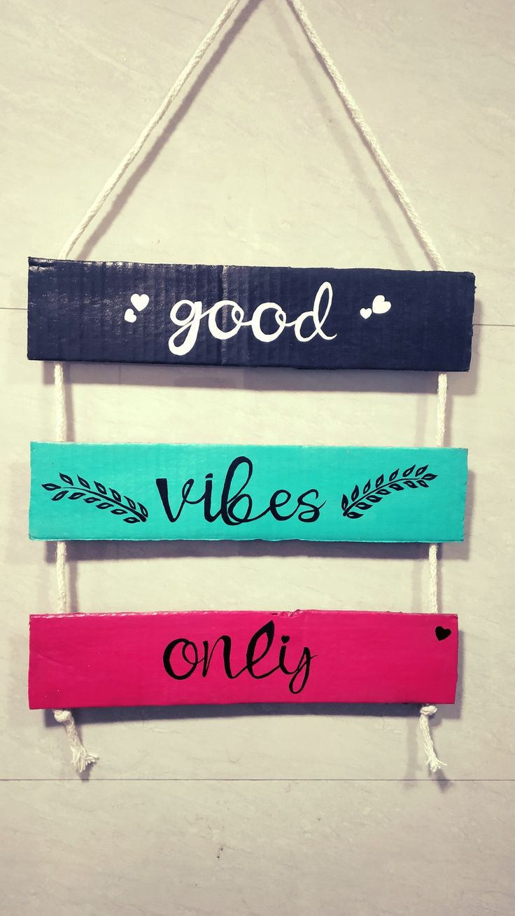 three wooden signs hanging on a wall saying good vibes only