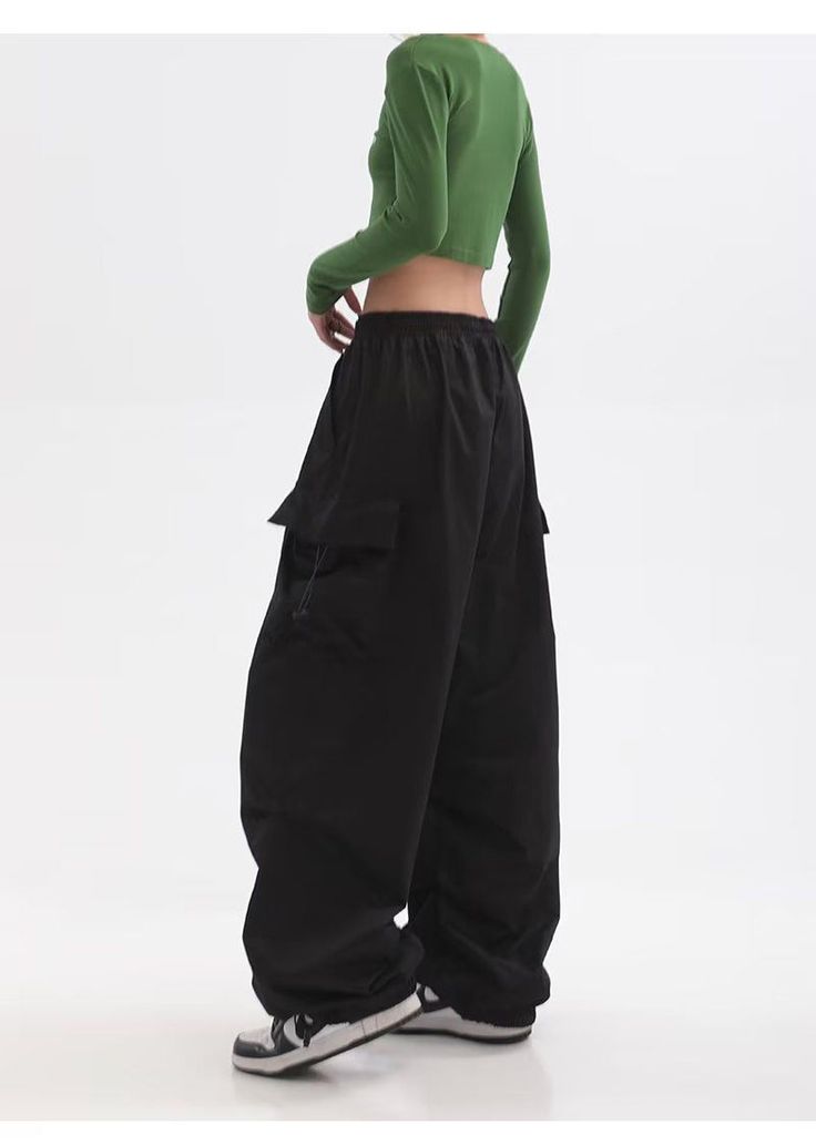 Features: Introducing the Women Punk Cargo Pants, perfect for the fashion-forward. Designed with a high waist and wide leg, these pants not only provide a flattering fit but also add a touch of streetwear edge to your wardrobe. Made with lightweight material, these pants are perfect for the summer season. Upgrade your style with these American Retro-inspired trousers. Baggy Y2k Full-length Pants, Y2k Style Baggy Full Length Pants, Y2k Full-length Baggy Pants, Y2k Wide-leg Pants With Pockets, Y2k Wide Leg Pants With Side Pockets, Y2k Wide Leg Bottoms For Fall, Trendy Wide-leg Parachute Pants With Side Pockets, Fall Y2k Wide Leg Bottoms, Fall Y2k High-waisted Pants