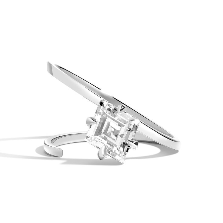 The 2020 engagement ring series is about restraint and paring down the unnecessary, leaving behind only what is the most important. The slant rings pay homage to bauhaus design with straight-forward simplicity and a streamlined aesthetic. The graphic slant playfully creates a thirty-five degree foundation to house the diamond. From the front, the diamond appears to hover on a singular oval disc. A hidden partial brace on the bottom keeps the ring from tilting.* A claw-set lozenge diamond is bala Lozenge Diamond, Bauhaus Design, Claw Setting, Recycled Gold, Ring Size Guide, Recycled Sterling Silver, Brilliant Diamond, 2 Carat, 1 Carat