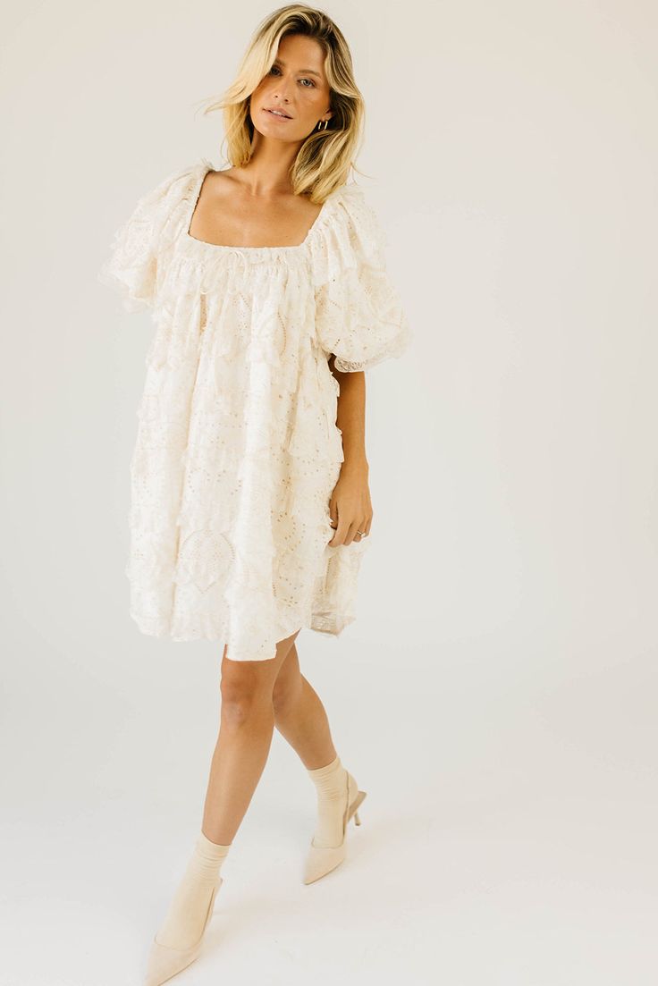 have your main character moment with this dreamy ivory puff sleeve mini dress. featuring dainty lace trim details + an elegant square neckline, this dress has heirloom-quality energy. from bridal showers to dinner dates, it’s guaranteed to be your new go-to. off white // mini length, scoop neckline, elastic neckline, lined, front bow detail, pockets, elastic cuffs model is 5'8" + wearing a small measurements are approximate + taken while laying flat xsmall : bust 32” length 31.5” small : bust 34 Feminine Puff Sleeve Dress With Lace Trim For Brunch, Puff Sleeve Dress With Lace Trim For Garden Party, Feminine Beige Puff Sleeve Dress With Square Neck, Puff Sleeve Mini Dress With Lace Trim For Brunch, Lace Puff Sleeve Dress For Brunch, Lace Mini Dress With Puff Sleeves For Wedding, Lace Mini Dress With Square Neck For Brunch, Spring Puff Sleeve Dress With Lace Trim, Feminine Cream Puff Sleeve Dress With Square Neck