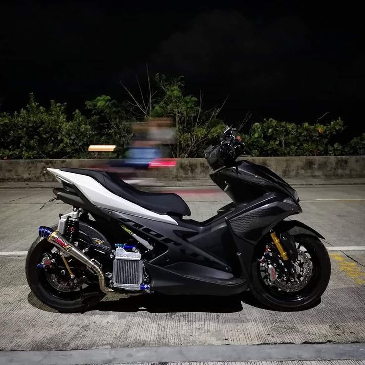 a motorcycle parked in a parking lot at night