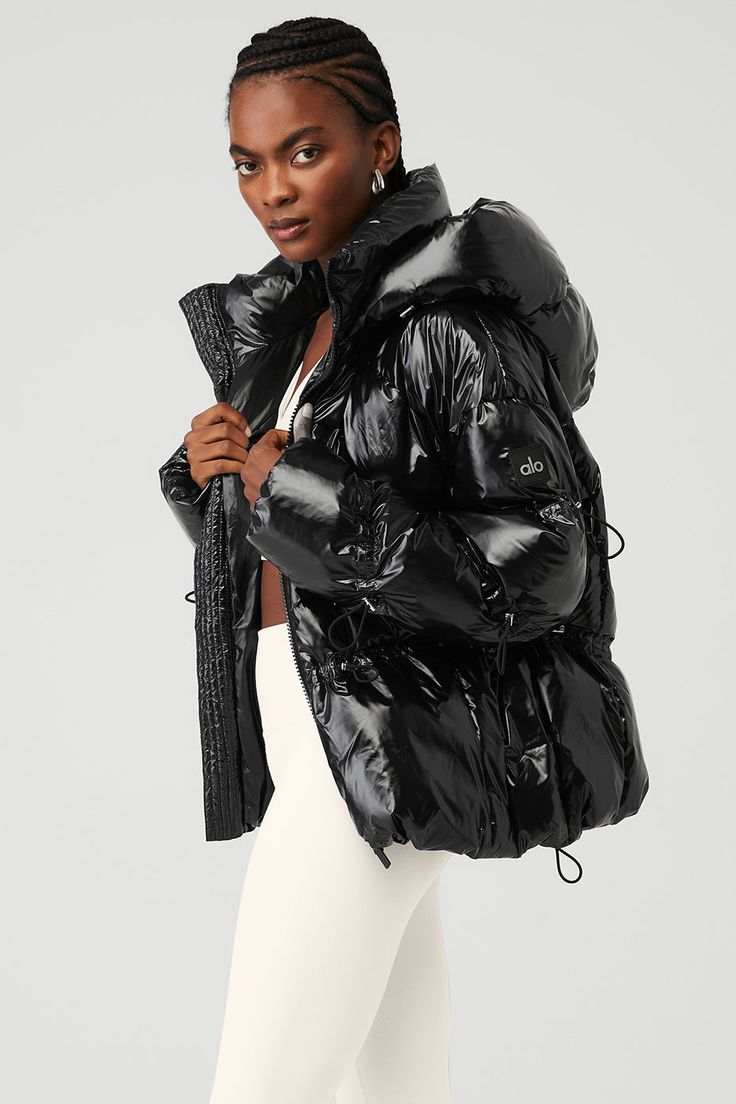 Make a statement in the Stunner Puffer Jacket. It has a glossy finish, a tall collar, dropped shoulders and seamed details throughout. The boxy, oversized cut is cinchable with bungee cords at the hood, waist and sleeves. So plush and warm, this jacket will have you looking forward to chilly temperatures. Bungee Cords, Black Puffer, Yoga Shop, All Black Outfit, Sweaters Knitwear, Alo Yoga, Black Outfit, Comfy Outfits, Looking Forward