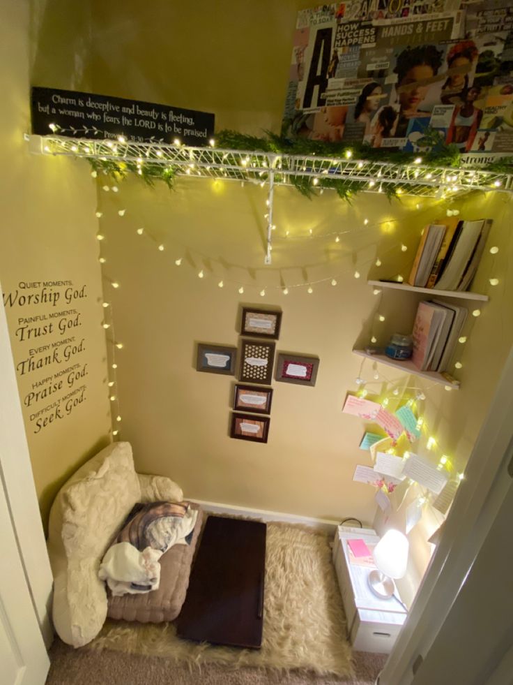 a small room with some lights on the ceiling and a dog bed in the corner