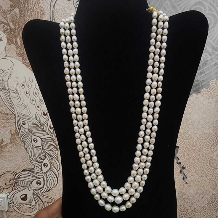 Enhance your style with this Three-Strand Pearl Necklace, featuring lustrous pearls in a classic layered design. Ideal for both formal and everyday wear, this piece adds a touch of timeless elegance to any ensemble. Material : Natural pearls & adjustable thread Three Strand Pearl Necklace, Crochet Jewellery, Emerald Bead, Tourmaline Necklace, Layered Design, Pin Pendant, Pendant Rings, Natural Emerald, Crochet Jewelry