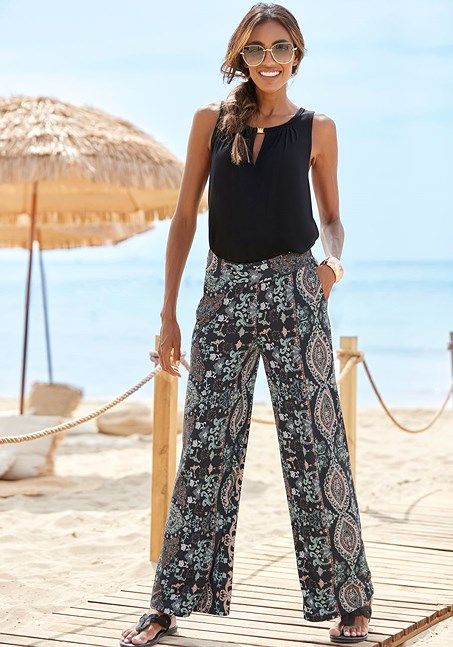 Embrace the artistry of fashion with our eye-catching wide-leg printed pants. Printed Wide-leg Pants For Vacation, Chic Printed Ankle-length Wide Leg Pants, Printed Wide Leg Pants For Vacation, Chic Ankle-length Printed Wide Leg Pants, Printed High-waisted Wide Leg Summer Pants, Chic Printed Pants For Summer, Printed High-waisted Wide Leg Pants For Vacation, Chic Patterned Bottoms For Vacation, Patterned Wide Leg Beach Bottoms