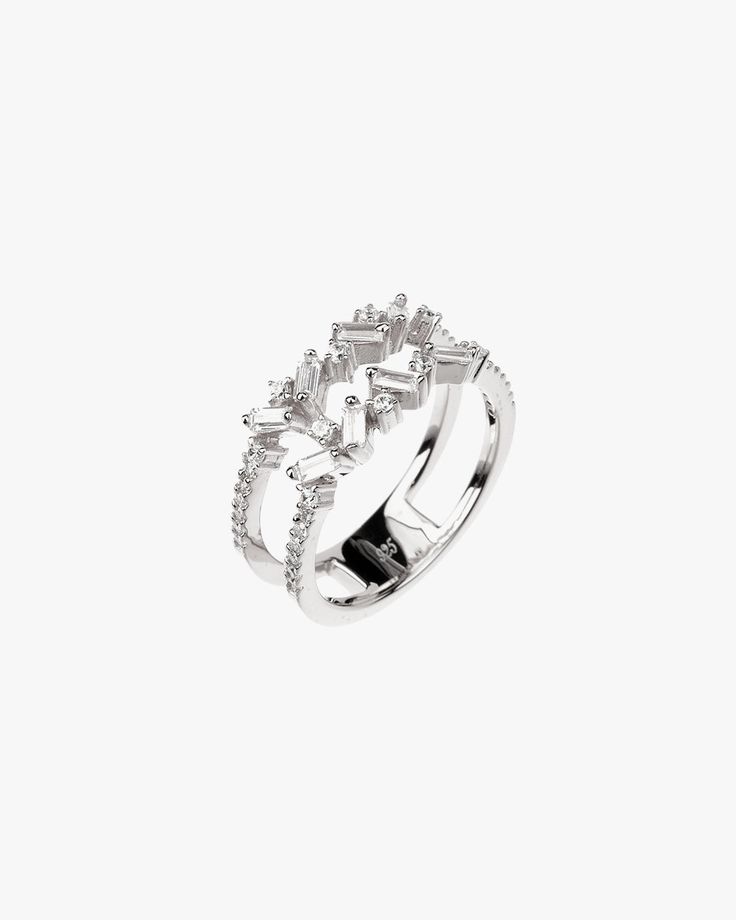 - Baguette cut gemstone for fashion ring- Made in Sterling silver set with a high-quality Cubic Zirconia. - Stone size: Baguette-cut 3 mm x 1.50 mm / Round cut 1.50 mm, 1.10 mm - Bandwidth: 8 mm Sterling silver925 Sterling Silver is an alloy made of 92.5% pure silver and 7.5% copper. We plate our silver jewelry in rhodium, which gives it extra shine and durability. Rhodium is one of the costliest precious metals due to its rarity.CareH2O sensitive. Avoid water when wearing your piece, because ov Silver Baguette Ring Fine Jewelry, Modern Jewelry With Baguette-cut Cubic Zirconia, Modern Baguette-cut Cubic Zirconia Jewelry, Modern Silver Diamond Ring With Baguette Diamonds, Silver Baguette Diamond Rings, Modern Cubic Zirconia Jewelry In Baguette Cut, Silver Baguette Cubic Zirconia Jewelry, Silver Jewelry With Sparkling Baguette-cut Stones, Silver Jewelry With Baguette Cut Sparkling Stones