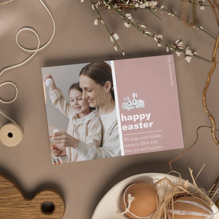 an easter greeting card on a table next to eggs